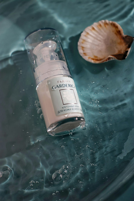 clear glass bottle on glass table