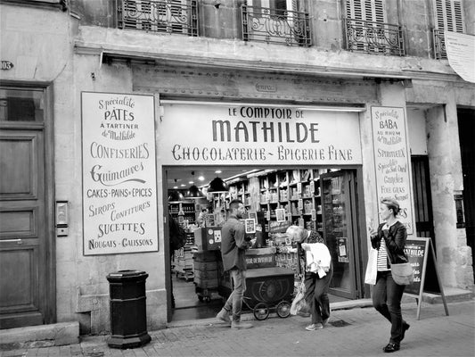 a black and white photo of a store front