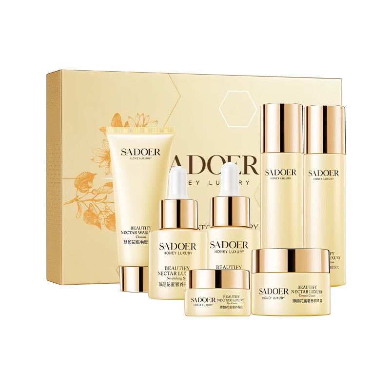 Sadoer Honey Luxury skincare set with creams, serums, and cleanser against golden box